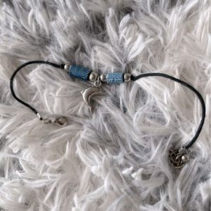 Dolphin ankle bracelet on black cord with blue and silver beads